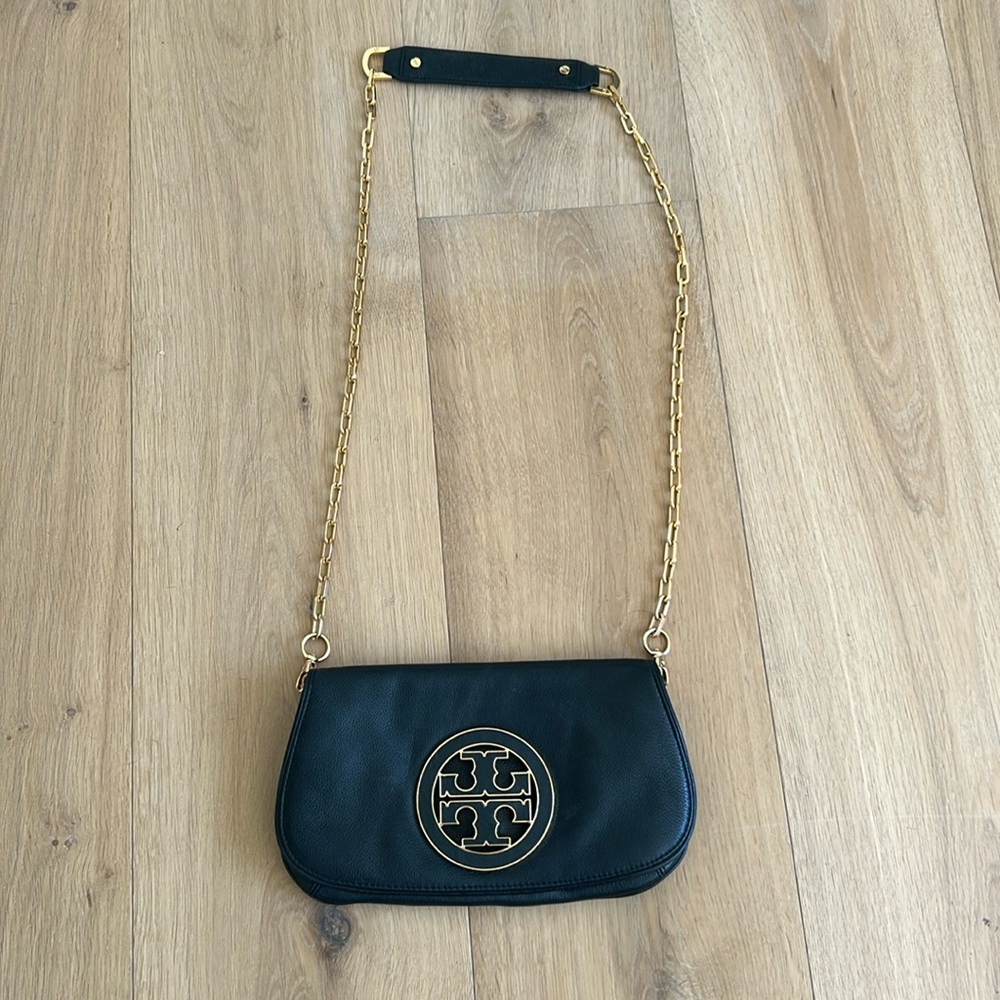 Tory Burch Reva Cross body leather black flap bag with gold chain strap.